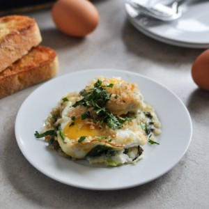 Fontina & Spinach Baked Eggs w/ Garlic Brown Butter Breadcrumbs